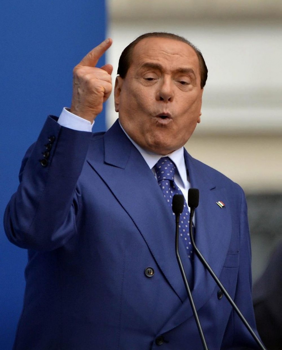 epa03696557 Italian former Prime Minister Silvio Berlusconi  delivers a speech during a rally organized by the People of Freedom party (PDL) in Brescia, 11 May 2013. Supporters of Silvio Berlusconi held a rally in northern Italy on Saturday to protest a court's decision to uphold a tax fraud conviction against the former prime minister. The rally took place in the northern city of Berscia where Berlusconi's People of Freedom party was convening. A Milan appeals court this week upheld an October ruling that sentenced the 76-year-old to four years' in jail; banned him from holding public office for five years; and excluded him from managerial positions in private companies for three years.  EPA/RICHARD MORGANO