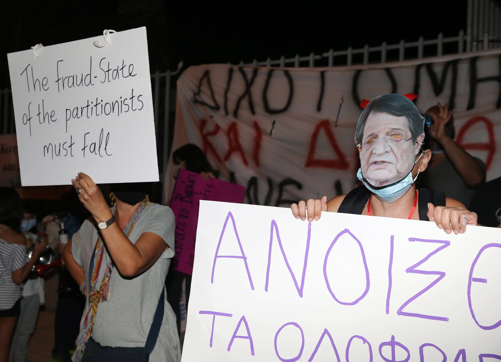 epa08745529 A person wearing a mask depicting Cyprus President Nicos Anastasiades, attends a protest against corruption in Nicosia, Cyprus, 14 October 2020. Hundreds of people gathered outside the Filoxenia Conference Center, currently hosting the Parliament, to protest and demand the resignation of the President of the Parliament, Demetris Syllouris who appeared in an undercover video of Al Jazeera offering to help a foreign businessman with a criminal record to acquire a Cyprus passport.  EPA/KATIA CHRISTODOULOU ArcInfo