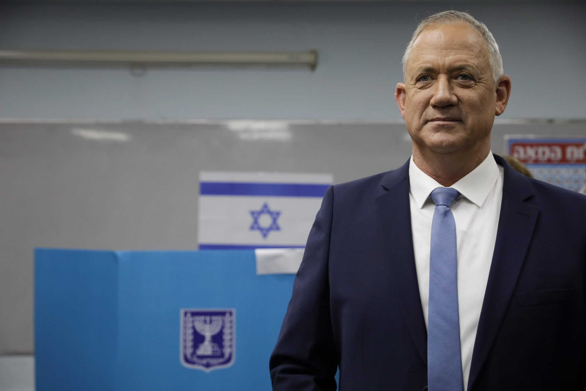 Blue and White party leader Benny Gantz talks to media after casting a ballot in Rosh Haayin, Israel, Monday, March 2, 2020. (AP Photo/Sebastian Scheiner) ArcInfo