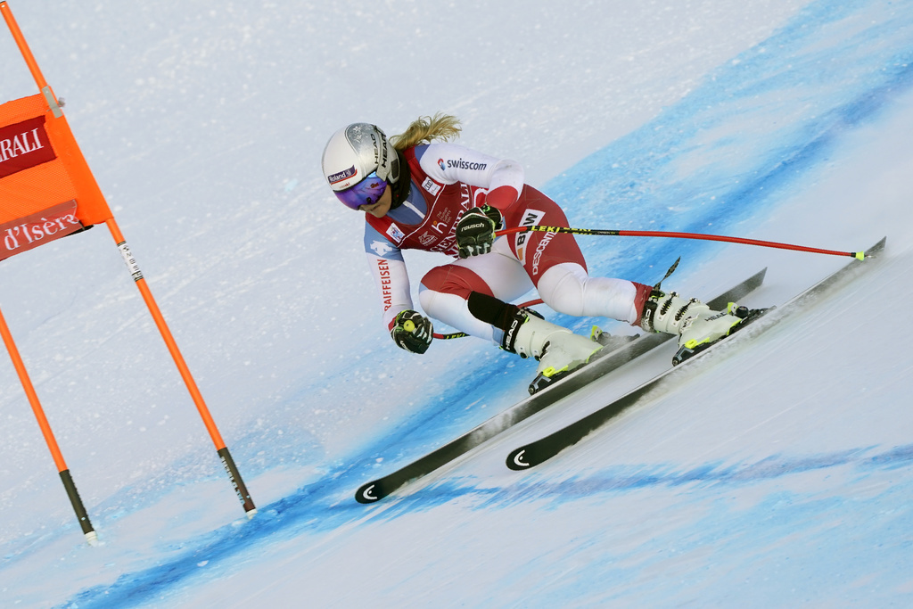 Switzerland's Corinne Suter speeds down the course during an alpine ski, women's World Cup downhill training, in Val d'Isere, France, Thursday, Dec.17, 2020. (AP Photo/Giovanni Auletta)