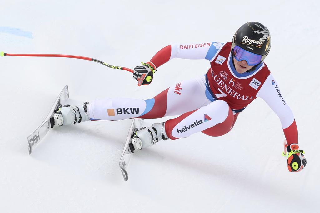 Switzerland's Lara Gut-Behrami speeds down the slope during an alpine ski, women's World Cup downhill, in Val di Fassa, Italy, Saturday, Feb. 27, 2021. (AP Photo/Alessandro Trovati)