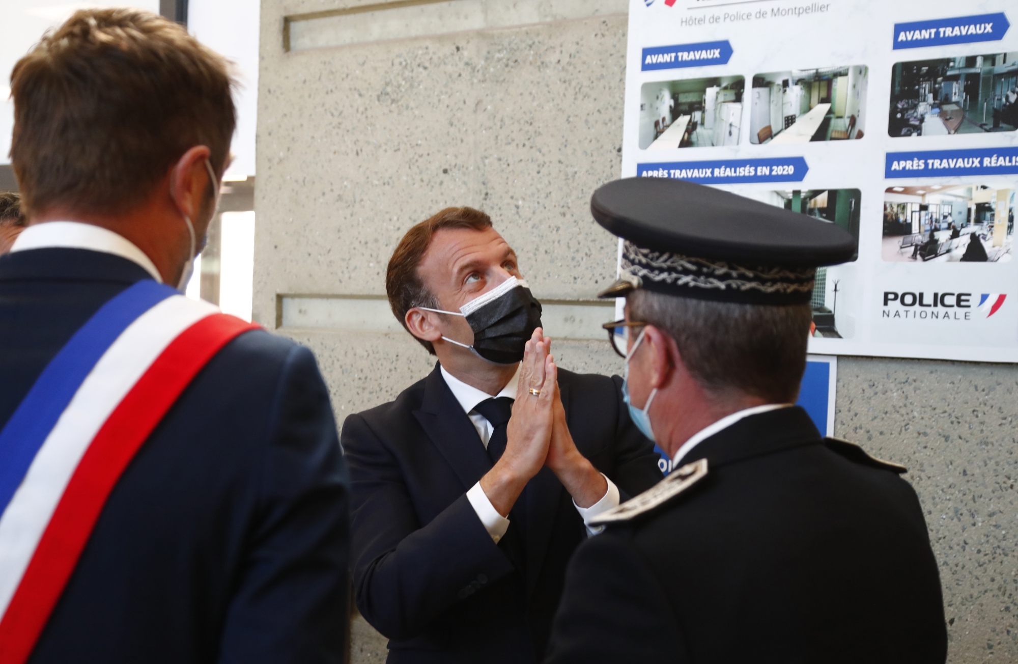 French President Emmanuel Macron visits the police headquarters in Montpellier, Southern France, Monday April, 19, 2021, accompanied by his Minister of Interior, Gerald Darmanin, during a one day visit to Montpellier on the theme of security and police. (Guillaume Horcajuelo/pool photo via AP)