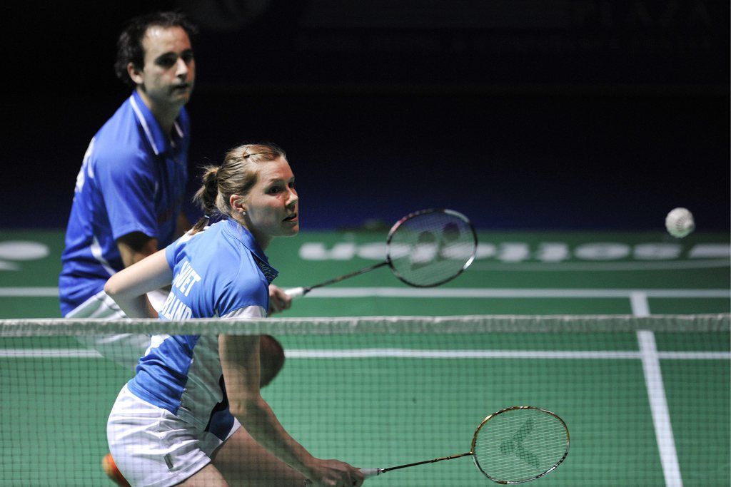 Switzerland's Sabrina Jaquet, front, and Anthony Dumartheray, back, return a shuttlecock to Denmark's Line Damkjaer Kruse and Anders Kristiansen during their mixed doubles first round match at the Badminton Swiss Open tournament in the St. Jakobshalle in Basel, Switzerland, Wednesday, March 12, 2012. (KEYSTONE/ Georgios Kefalas)