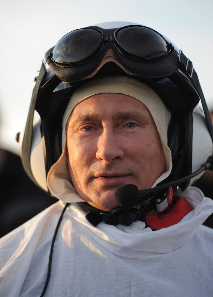 Russian President Vladimir Putin prepares for a flight in a motorized hang glider, on the Yamal Peninsula, in Russia Wednesday Sept. 5, 2012. Putin took part in a flight as part of a program devised by environmentalists to lead a flock of endangered Siberian white cranes, which were raised in captivity, on their migration to Asia. (AP Photo/RIA-Novosti, Alexei Druzhinin, Presidential Press Service)