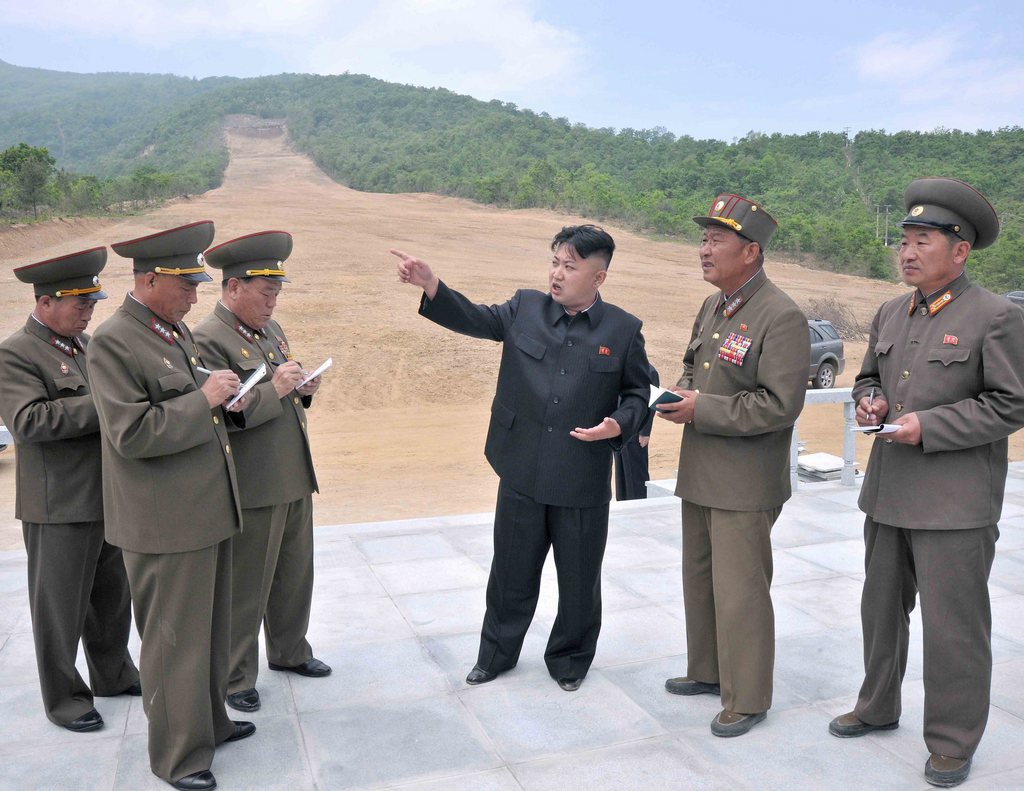 epa03720254 A photo released May 27 2013 by the North Korean official agency Korean Central News Agency shows an undated pic of North Korean leader Kim Jong-un (C) during his visit to a ski resort construction site in Masik Pass in Wonsan Province. KCNA said Kim was satisfied with the progress made in the construction of the skiing gatepost, hotel, skiing apparatuses storehouse, heliport and cableway. He said the resort is in the best place to ensure a long skiing season and easier access with the Pyongyang-Wonsan tourist motorway.  EPA/KCNA SOUTH KOREA OUT  EDITORIAL USE ONLY/NO SALES