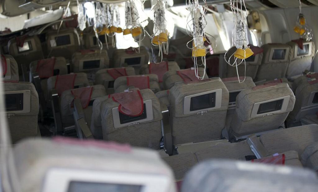 This image released by the National Transportation Safety Board, Sunday, July 7, 2013, shows the interior of the Boeing 777 Asiana Airlines Flight 214 aircraft. The Asiana flight crashed upon landing Saturday, July 6, at San Francisco International Airport, and two of the 307 passengers aboard were killed. (AP Photo/NTSB)