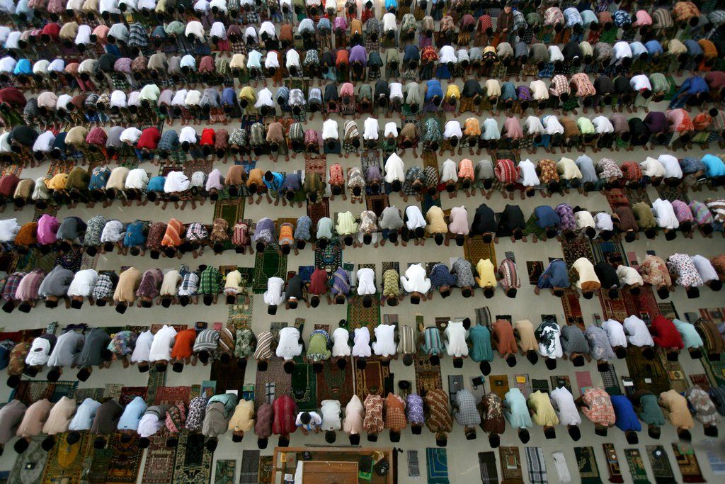 Students perform an afternoon prayer on the first day of the holy fasting month of Ramadan, at Ar-Raudlatul Hasanah Islamic boarding school in Medan, North Sumatra, Indonesia, Wednesday, July 10, 2013. During Ramadan Muslims refrain from eating, drinking, smoking and sex from dawn to dusk.  (AP Photo/Binsar Bakkara)