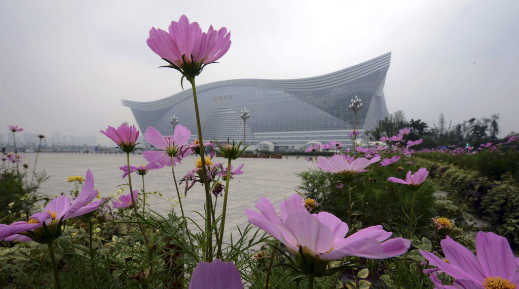 In this photo taken Monday July 8, 2013, the New Century Global Center, the world?s largest single building, stands in the suburbs of Chengdu, in southwest China's Sichuan province. The world?s largest building, in terms of floor space, has opened to the public in the booming Chinese city of Chengdu. (AP Photo) CHINA OUT