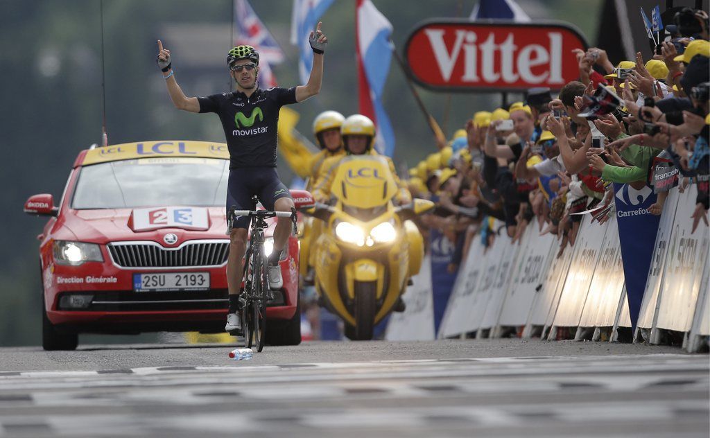 Rui Alberto Costa of Portugal crosses the finish line to win the nineteenth stage of the Tour de France cycling race over 204.5 kilometers (127.8 miles) with start in in Bourg-d'Oisans and finish in Le Grand-Bornand, France, Friday July 19 2013. (AP Photo/Peter Dejong)