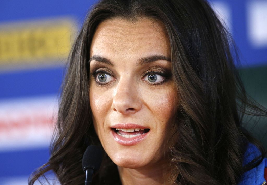 Russia's Yelena Isinbayeva, the gold medalist in the women's pole vault,  speaks during a press conference at the World Athletics Championships in the Luzhniki stadium in Moscow, Russia, Thursday, Aug. 15, 2013.   (AP Photo/Alexander Zemlianichenko)