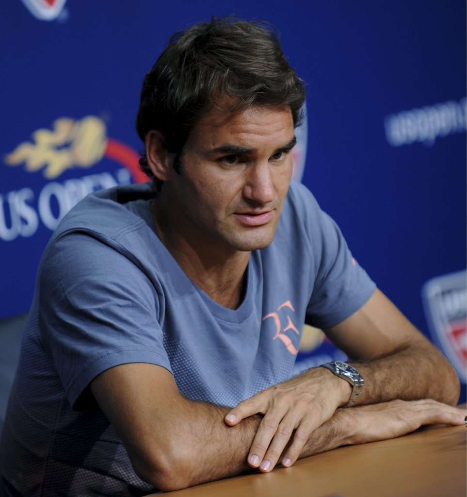 epa03836209 Swiss tennis player Roger Federer speaks at a media interview at the US Open Tennis Arthur Ashe Kids' Day in Flushing Meadows, New York, New York, USA, 24 August 2013. The first round of the Open begins on 26 August and runs through 09 September 2013.  EPA/PETER FOLEY