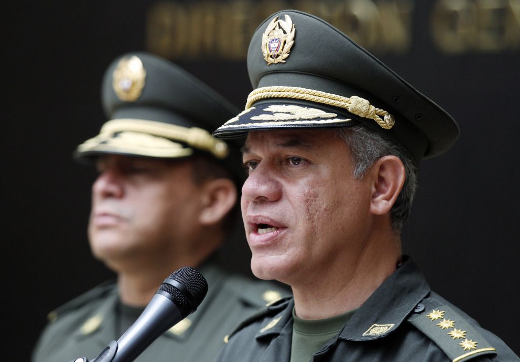 Colombia National Police Chief Gen. Jose Roberto Leon, right, talks during a press conference about the capture of a top fugitive Italian cocaine boss, at police headquarters in Bogota, Colombia, Saturday, July 6, 2013. Roberto Pannunzi, believed to be one of the world's most powerful drug brokers and who prosecutors allege arranged monthly shipments of tons of South American cocaine to Europe, has been captured in Bogota in a shopping mall, Gen. Leon said. (AP Photo/Fernando Vergara)