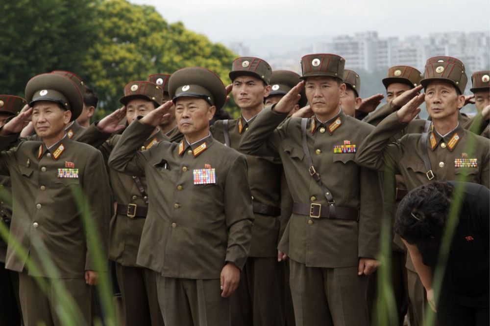 North Korean army officers and soldiers salute to show their respect to late North Korean leaders Kim Il Sung and Kim Jong Il on the 19th anniversary of Kim Il Sung's death, Monday, July 8, 2013, on Mansu Hill  in Pyongyang, North Korea.  (AP Photo/Jon Chol Jin)