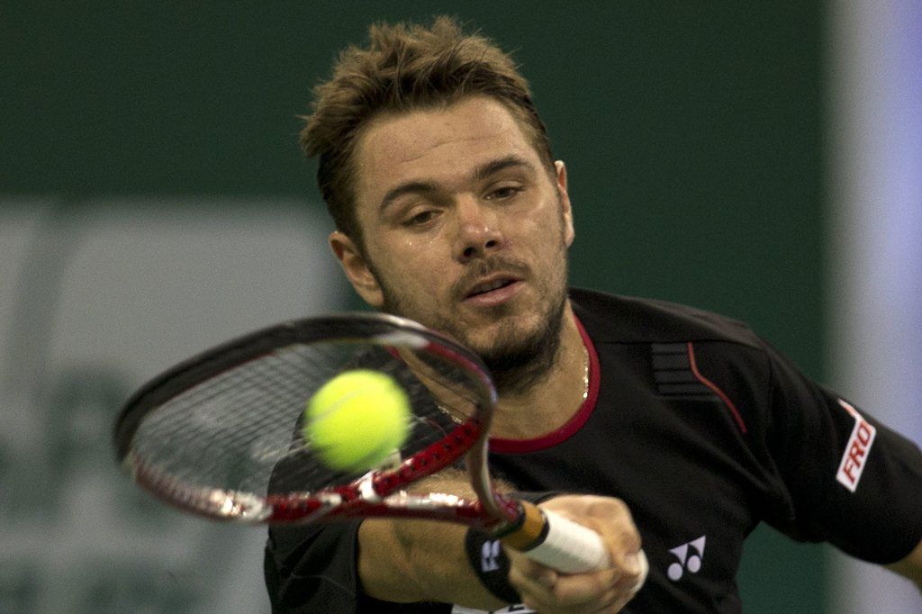 Switzerland?s Stanislas Wawrinka returns a shot to Spain?s Rafael Nadal during a quarterfinal match for the Shanghai Masters tennis tournament at the Qizhong Forest Sports City Tennis Center in Shanghai, China on Friday, Oct. 11, 2013. (AP Photo/Ng Han Guan)