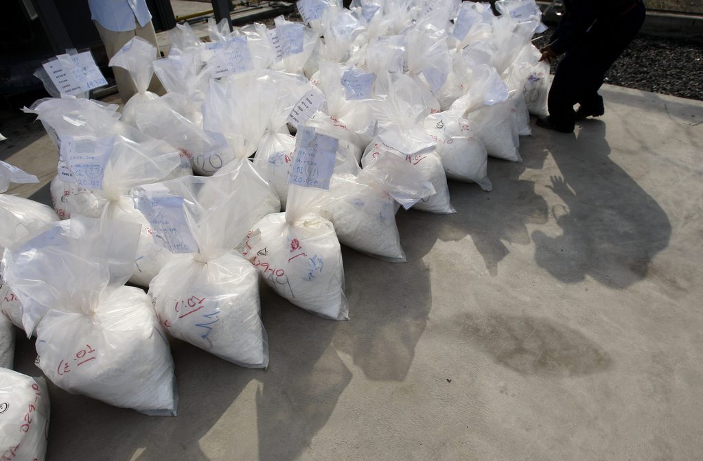Bags containing cocaine are readied for burning at a police base in Lima, Peru, Tuesday Dec. 21, 2010. According to police, some 13 tons of narcotics, such as cocaine, marijuana and heroin seized in different operations during the last 4 months, were burned. (AP Photo/Karel Navarro)