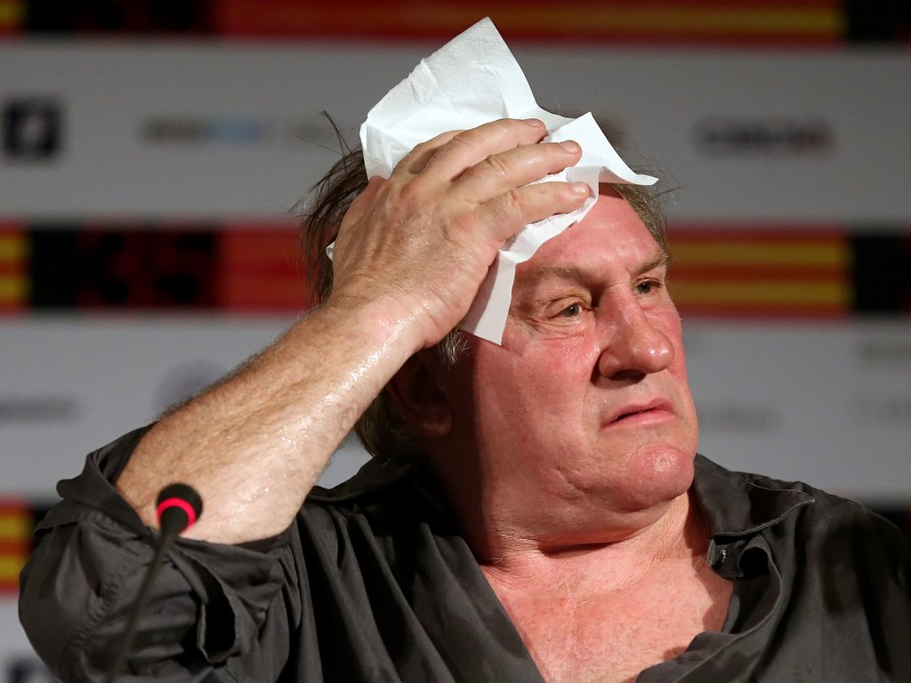 epa03765883 French actor Gerard Depardieu gestures during a press conference for the movie 'Rasputin' at the 35th annual Moscow International Film Festival in Moscow, Russia, 29 June 2013. The festival closes on 29 June with the screening of 'Rasputin'.  EPA/SERGEI CHIRIKOV