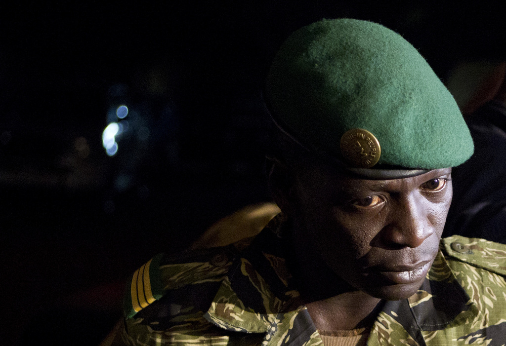 FILE - In this March 31, 2012 file photo, junta leader Capt. Amadou Haya Sanogo speaks to journalists at his headquarters in the Kati military camp, just outside Bamako, Mali. The man who led last year?s coup, reversing two decades of democracy in Mali, has been summoned by the nation?s judiciary to answer allegations that he and his men tortured and killed fellow soldiers who didn?t back his rise to power, an official in the ministry of justice confirmed on Friday, Nov. 1, 2013. (AP Photo/Rebecca Blackwell, File)