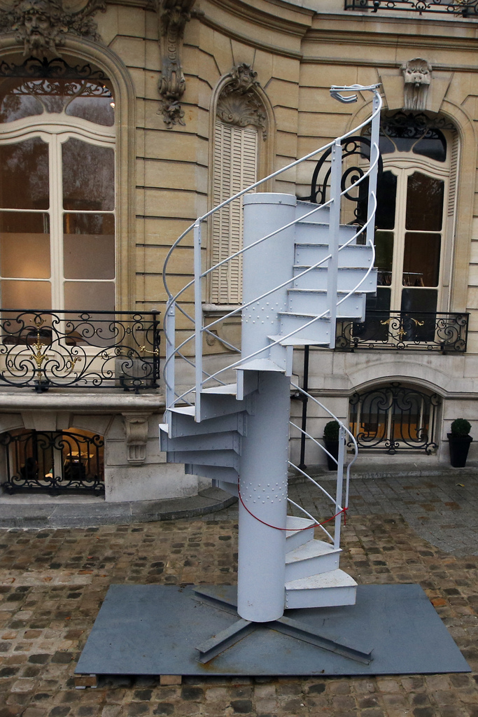 A 15-step segment of the Eiffel Tower?s original spiral staircase from 1889, consigned from a Swiss collection, which helped connect the 2nd and 3rd decks is displayed at Artcurial on the Champs Elysees, in Paris, Wednesday Nov. 20, 2013. The nearly 12ft tall and 750kg segment is part of Artcurial?s prestige 152-lot sale of 20th Century Decorative Arts that will be held on Nov. 25, 2013 under the gavel of Francois Tajan, where it is estimated to fetch up to US$ 40,628. (AP Photo/Francois Mori)