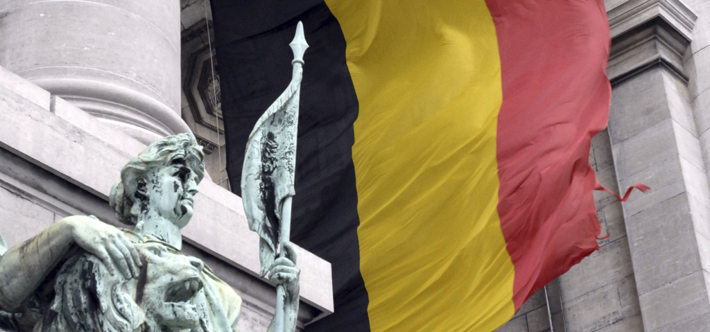 ** FILE **  In this Dec. 3, 2007 file photo a tattered Belgian flag is seen blowing in the wind at the Cinquantenaire monument in  Brussels. On Friday Dec. 19, 2008 Belgium's Prime Minister Yves Leterme offered the resignation of his government over the handling of the botched Fortis bank bailout.   (AP Photo/Thierry Charlier, File)