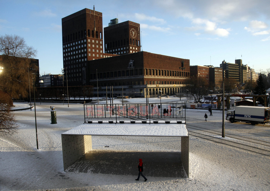 A man walks past the Portal to the World Thursday Dec. 9, 2010 in front of city hall in Oslo, Norway where a ceremony will be held to commemorate Nobel Peace laureate Liu Xiaobo. A ceremony Friday to mark the award of the Nobel Peace prize to Liu Xiaobo, a jailed Chinese dissident, is turning into a global showdown reminiscent of confrontations between the democratic world and Nazi Germany or the Soviet Union.  (AP Photo/John McConnico)