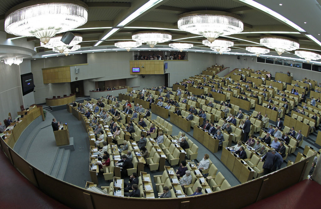 Members of the State Duma, lower parliament chamber, is seen during a session in Moscow, Russia, Tuesday, July 10, 2012. Russia's parliament is due to ratify an agreement for Russia to join the World Trade Organization in a move that will push Moscow to open up its economy. (AP Photo/Misha Japaridze)