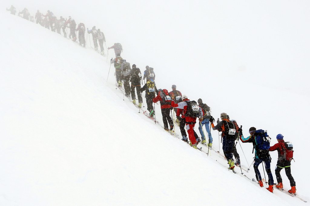 Competitors of the Glacier Patrol race on their way to La Barma, during the 13th edition of the Glacier Patrol race, in Verbier, South-Western Switzerland, Saturday, April 19, 2008. The Glacier Patrol (Patrouille des Glaciers) organized by the Swiss Army sees highly-experienced hiker-skiers trek across the Haute Route along the Swiss-Italian border from Zermatt to Verbier. The race covers 53 kilometers (31.8 miles) by foot and ski, with over 7000 meters gained and lost along the way. (KEYSTONE/Jean-Christophe Bott)
