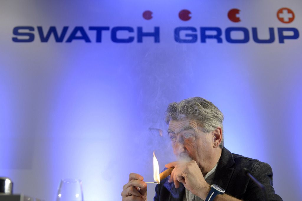 CEO of Swiss watch company Swatch Group, Nick Hayek, smokes during a press conference about the year 2013 final results presentation, Thursday, March 20, 2014, in Geneva, Switzerland. (KEYSTONE/Martial Trezzini)