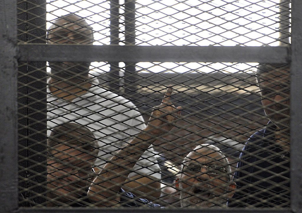 epa04243597 Egypt's Muslim Brotherhood Supreme Guide Mohamed Badie speaks from behind an enclosed dock during a trial session in Cairo, Egypt, 07 June 2014. An Egyptian court handed down preliminary death sentences to 10 Muslim Brotherhood supporters on charges of murder, violence and blocking a road north of Cairo while protesting for Islamist president Mohammed Morsi last year.  EPA/TAHSEEN BAKR EGYPT OUT