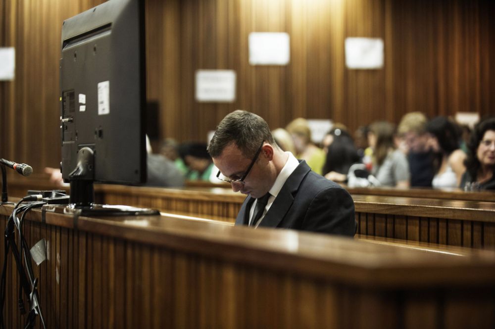 Oscar Pistorius sits in the dock in court in Pretoria, South Africa, Wednesday, May 14, 2014,  as the judge overseeing his murder trial ordered him to undergo psychiatric tests, meaning that the trial proceedings will be delayed. The court adjourned until May 21, 2014. Pistorius is charged with murder for the shooting death of his girlfriend Reeva Steenkamp on Valentine's Day in 2013.   (AP Photo/Gianluigi Guercia, Pool)