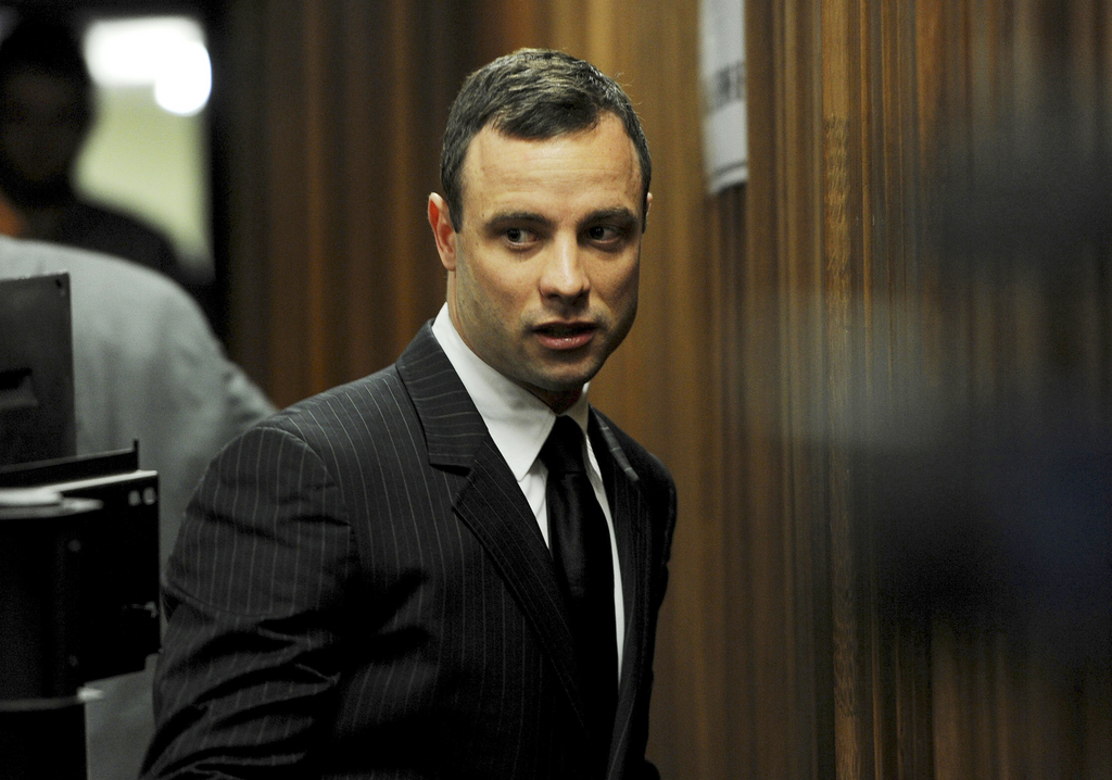 Oscar Pistorius arrives at court in Pretoria, Wednesday, July 2, 2014. Pistorius' trial continues with evidence being heard from his agent testifying being tried at the double-amputee runner's murder trial surrounding the death of his girlfriend Reeva Steenkamp.  (AP Photo/Werner Beukes, Pool)