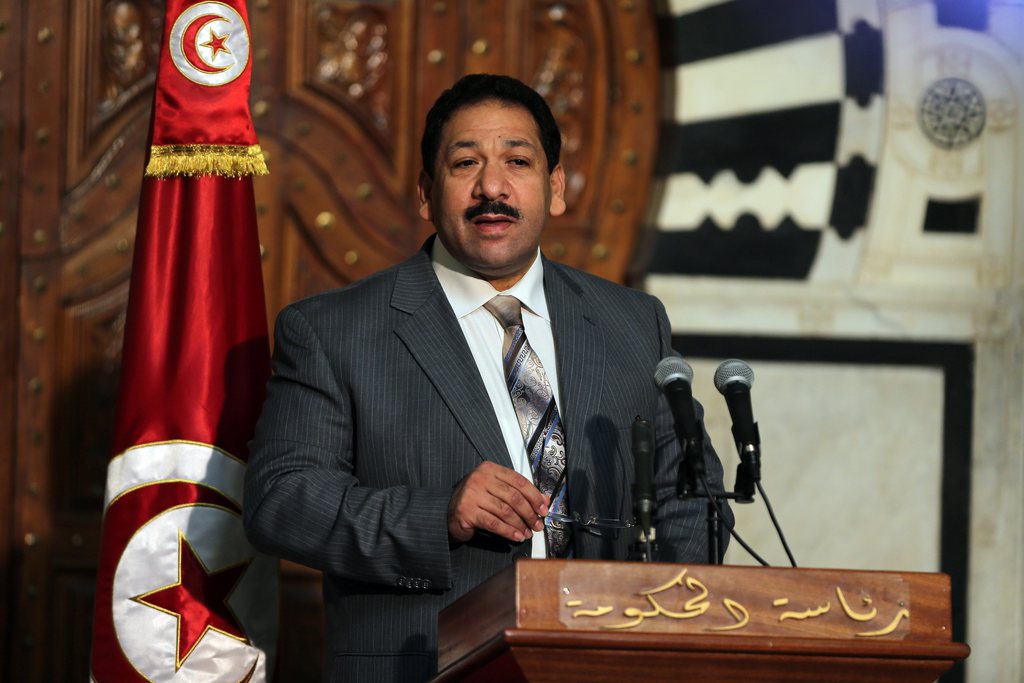 epa04319986 Tunisian Minister of Interior Lotfi Ben Jeddou speaks during a press conference with Tunisian Minister of National Defence Ghazi Jeribi (not pictured) at the Government Palace in Tunis, Tunisia on 17 July 2014. Jeribi, said that the number of terrorists who carried out yesterday's attack in the area near the Mont Henchir Ettela Chaambi varies between 40 and 60 members. At least 14 Tunisian soldiers were killed in an attack by suspected Islamist militants on security checkpoints near the Tunisian border with Algeria, the Defence Ministry said 17 July. The attack occurred 16 July evening in the western area of Mount Chaambi, where the army is carrying out an anti-militant campaign, according to the ministry's spokesman Rachid Hawela.  EPA/MOHAMED MESSARA