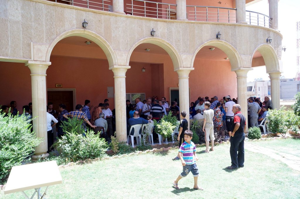 epa04324742 Displaced Iraqi Christians who fled with families from Mosul city wait at Virgin Mary church in Qaraqosh village near Mosul city , northern Iraq on 20 July 2014. Iraq's second-biggest city has been cleared of Christians, an Iraqi official said, as Mosul final Christian families, facing an ultimatum from Islamist militants at home, fled to the autonomous region of Kurdistan. 'The numbers of Christians in Mosul were around 50,000 people' said Bashar Kiki, a local council chief in the northern province of Nineveh, where Mosul is the key city.  EPA/MOHAMMED AL-MOSULI