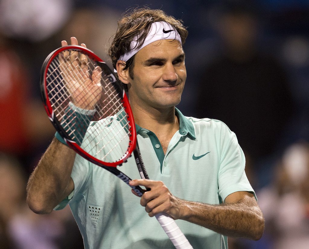 Roger Federer, of Switzerland, celebrates his win over Marin Cilic, of Croatia, in a Rogers Cup tennis match in Toronto on Thursday, Aug. 7, 2014. Federer won 7-6 (5), 6-7 (3), 6-4  (AP Photo/The Canadian Press, Frank Gunn)