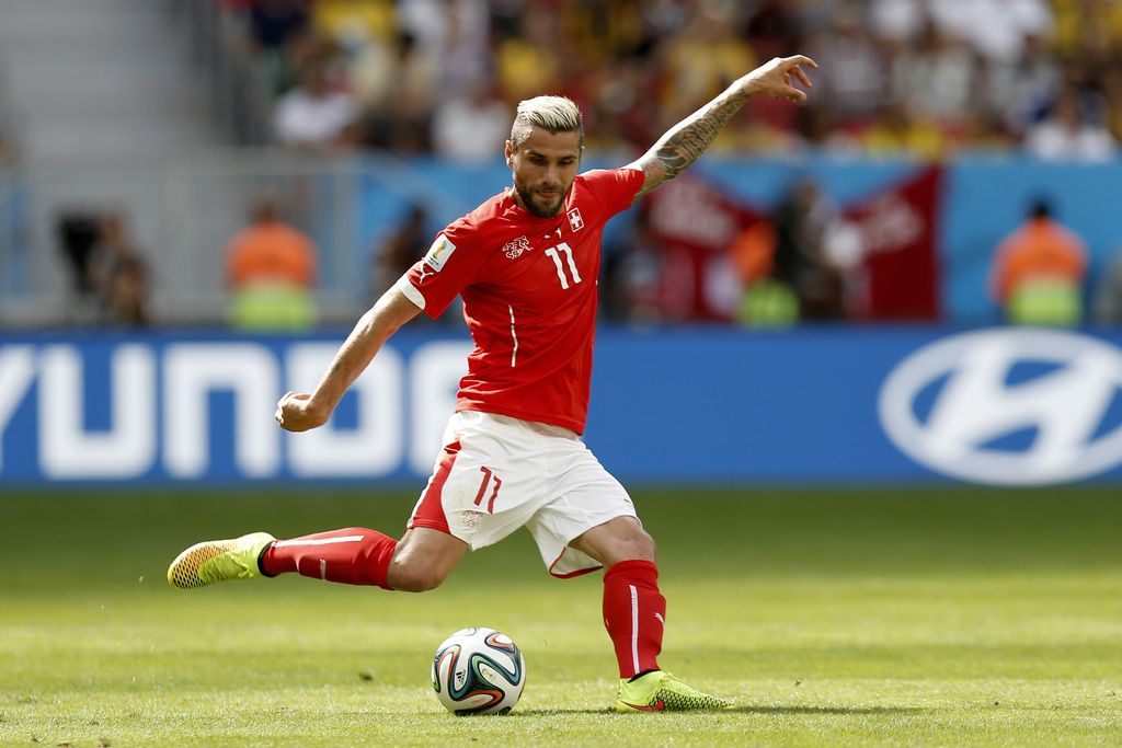 Switzerland's Valon Behrami in action during the group E preliminary round match between Switzerland and Ecuador in the National Stadium in Brasilia, Brazil, Sunday, June 15, 2014. (KEYSTONE/Peter Klaunzer)....RESTRICTIONS APPLY: Editorial Use Only, not used in association with any commercial entity - Images must not be used in any form of alert service or push service of any kind including via mobile alert services, downloads to mobile devices or MMS messaging - Images must appear as still images and must not emulate match action video footage - No alteration is made to, and no text or image is superimposed over, any published image which: (a) intentionally obscures or removes a sponsor identification image; or (b) adds or overlays the commercial identification of any third party which is not officially associated with the FIFA World Cup.