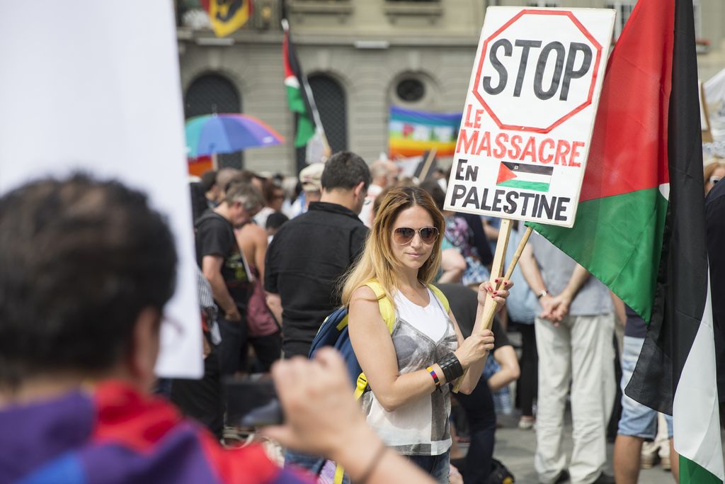 A protester poses for a picture during a protest against Israel and to show solidarity to the people in the Gaza strip, at the Bundesplatz in Bern, Switzerland, Saturday, August 2, 2014. (KEYSTONE/Peter Klaunzer)