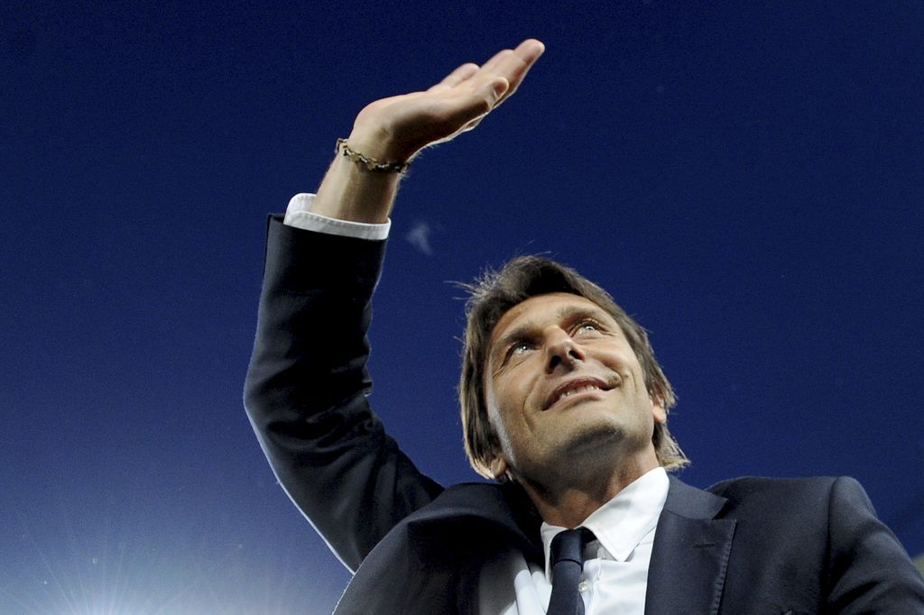 FILE - In this May 5, 2014 file photo, Juventus coach Antonio Conte waves to supporters prior to the start of a Serie A soccer match between Juventus and Atalanta at the Juventus stadium, in Turin, Italy. Former Juventus manager Antonio Conte is the new coach of Italy, after signing a two-year contract. The Italian football federation announced the news on Thursday, Aug. 14, 2014 three days after new president Carlo Tavecchio was elected. The 45-year-old Conte replaces Cesare Prandelli, who resigned, along with former FIGC president Giancarlo Abete, immediately after Italy's early elimination from the World Cup in Brazil. (AP Photo/Massimo Pinca, File)