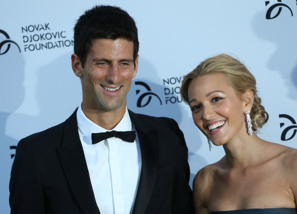 FILE - In this  Monday, July 8, 2013 file photo, Novak Djokovic, and Jelena Ristic arrive at a Gala dinner at the Roundhouse in Camden, north London, for the inaugural London fundraiser in aid of the Novak Djokovic Foundation. Novak Djokovic has tied the knot. The Wimbledon champion married his longtime girlfriend Jelena Ristic on Thursday, July 10 in an upscale resort on the Adriatic coast in Montenegro. Local media say the couple held a private ceremony, attended by family, friends and guests, but away from public eye. Authorities in Montenegro have sealed off Milocer and Sveti Stefan resorts to grant privacy. Djokovic and Ristic first met in high school. They have been a couple for more than eight years and are expecting their first child. (AP Photo/Ben Curtis, file)