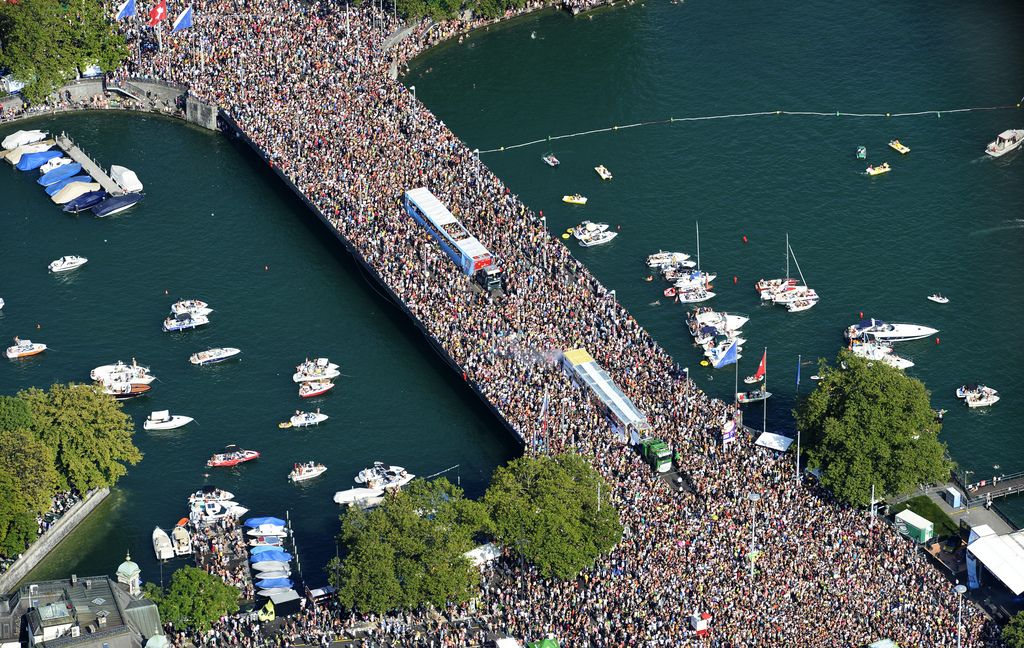 Hundreds of thousands of people gather in the city center of Zurich, Switzerland, as they participate in the annual Street Parade, on Saturday, August 2, 2014. (KEYSTONE/Steffen Schmidt)