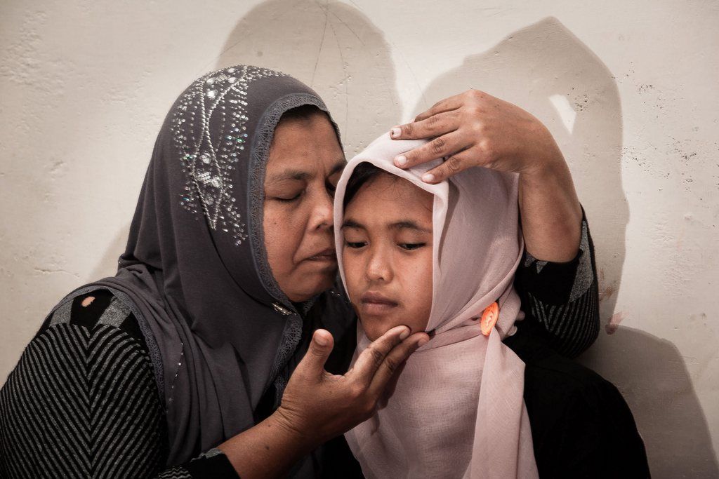 epa04345155 Jamaliah (L) gives a hug to her daughter Raudhatul Jannah (R) after being reunited in Meulaboh, Aceh, northern Sumatra, Indonesia, 07 August 2014. Raudhatul Jannah went missing during the Indonesian tsunami nearly ten years ago after she was rescued by fishermen drifting on the Indian Ocean on 26 December 2004. Her uncle spotted her in another village in June 2014 and noticed a striking resemblance to the missing girl and checks confirmed it was her. The December 2004 Tsunami killed more than 170.000 people in Aceh province alone.  EPA/ACHWA NUSSA AUSTRALIA AND NEW ZEALAND OUT