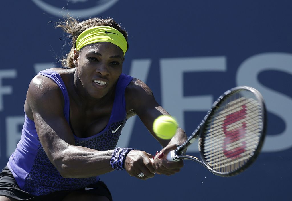 Serena Williams returns the ball to Andrea Petkovic, from Germany, during the second set of a semifinal in the Bank of the West Classic tennis tournament in Stanford, Calif., Saturday, Aug. 2, 2014. Williams won 7-5, 6-0. (AP Photo/Jeff Chiu)