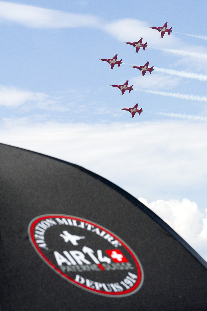 Tiger F5-E jets of the Patrouille Suisse perform at the AIR14 air show in Payerne, Switzerland, Sunday, September 7, 2014. The Air show AIR14 of the Swiss army marks the 100th anniversary of the Air Force also as the 50th anniversary of the Patrouille Suisse and the 25th anniversary of the PC-7 Team. AIR 14 runns during two different weekends, the 30 and 31 August and the 6 and 7 September 2014. (KEYSTONE/Anthony Anex)