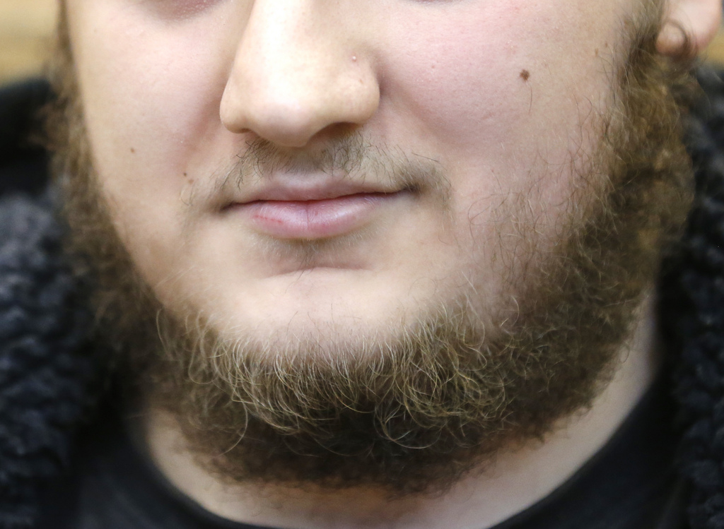 German Kreshnik B. waits for the beginning of his trial at a higher regional court in Frankfurt,  Germany, Monday, Sept.15, 2014. He is accused of having been a member of the Islamic state group in Syria. He was arrested when he came back to Germany in December 2013. (AP Photo/Michael Probst)