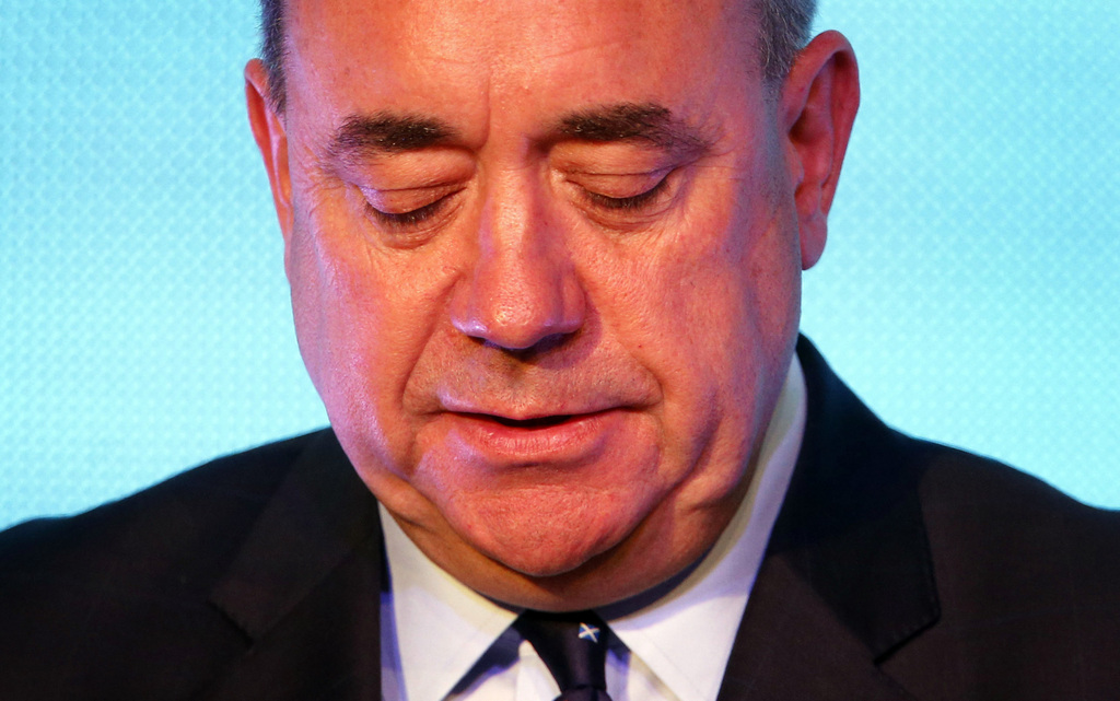 Scottish First Minister Alex Salmond looks down during a press conference in Edinburgh, Scotland, Friday, Sept. 19, 2014. Scottish voters have rejected independence and decided that Scotland will remain part of the United Kingdom. The result announced early Friday was the one favored by Britain's political leaders, who had campaigned hard in recent weeks to convince Scottish voters to stay. It dashed many Scots' hopes of breaking free and building their own nation. (AP Photo/PA, Danny Lawson) UNITED KINGDOM OUT, NO SALES, NO ARCHIVE