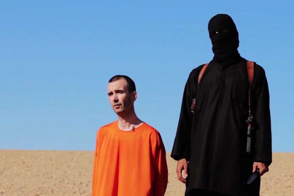 EDS NOTE: GRAPHIC CONTENT - This image made from video posted on the Internet by Islamic State militants and provided by the SITE Intelligence Group, a U.S. terrorism watchdog, on Saturday, Sept. 13, 2014, purports to show British aid worker David Haines before he was beheaded. The video emerged hours after the family of Haines issued a public plea on Saturday urging his captors to contact them. The 44-year-old Haines was abducted in Syria in 2013 while working for an international aid agency. (AP Photo)