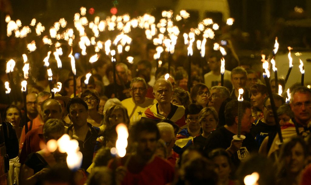 People hold torches during a march for the independence of Catalonia in Barcelona, Spain, Wednesday, Sept. 10, 2014. After years of mass protests by Catalans demanding the right to decide whether they want to break away from Spain and form a new European nation, the wealthy northeastern region?s lawmakers are voting to ask permission from Spanish authorities to hold a secession referendum in November. (AP Photo/Manu Fernandez)