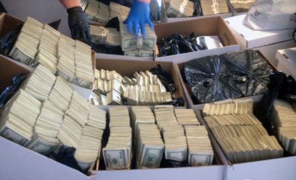 This photo provided by U.S. Immigration and Customs Enforcement shows boxes of cash that was part of seizure by Homeland Security Investigations in Los Angeles on Wednesday, Sept. 10, 2014. Federal authorities have arrested nine people and seized roughly $65 million in a crackdown on suspected drug money laundering in the fashion district of Los Angeles. (AP Photo/U.S. Immigration and Customs Enforcement )
