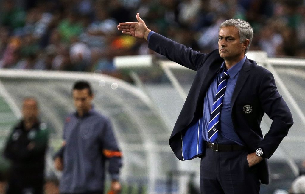 Chelsea's head coach Jose Mourinho watches a Champions League, Group G soccer match between Sporting and Chelsea, in Lisbon, Tuesday, Sept. 30, 2014. (AP Photo/Francisco Seco)