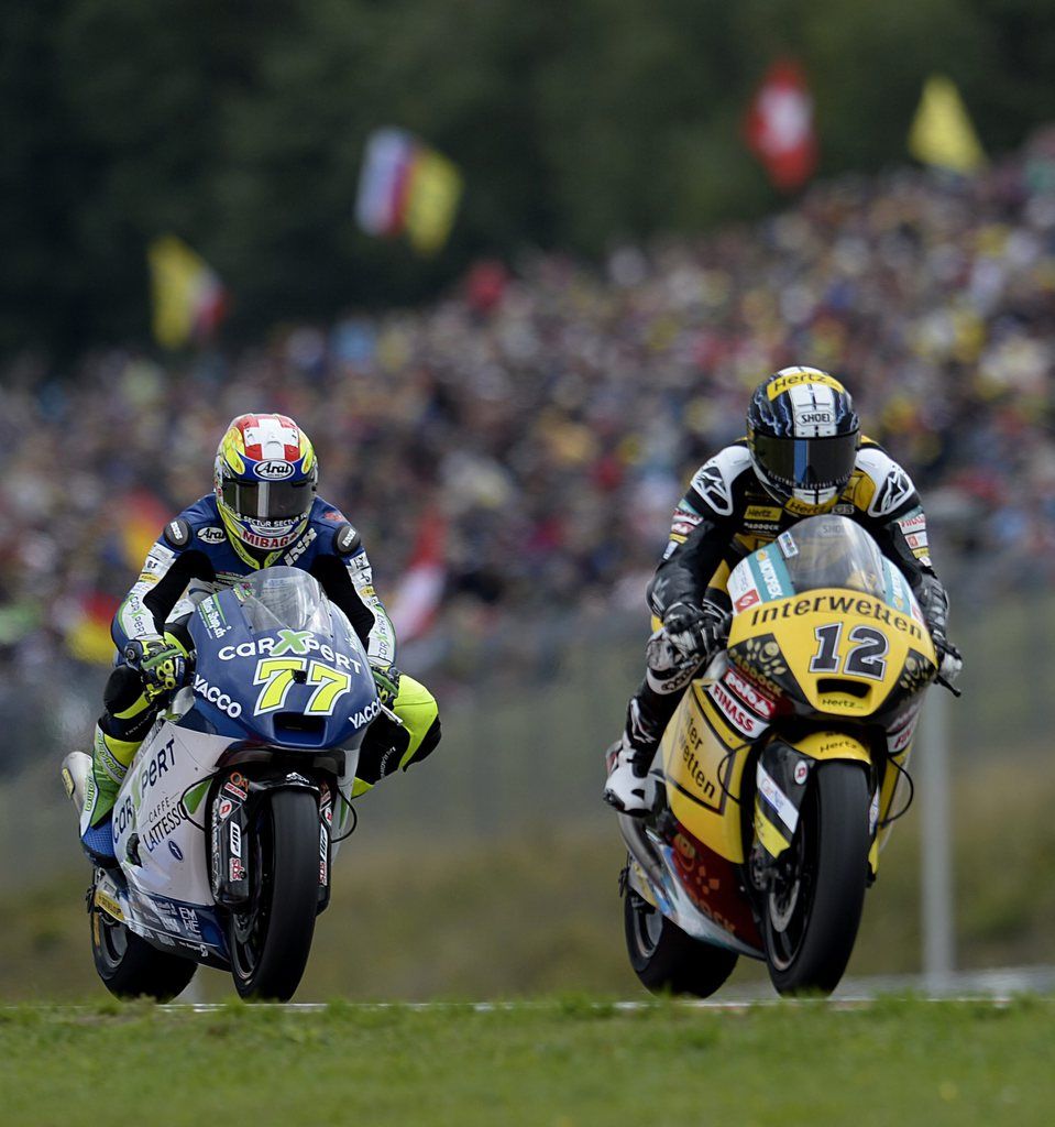 epa04357639 Swiss Moto2 rider Thomas Luthi (R) of the Interwetten-Paddock team and Swiss Moto2 rider Dominique Aegerter of the Technomag carXpert team in action during the Moto2 race at the Czech Republic Motorcycling Grand Prix on the Masaryk circuit in Brno, Czech Republic, 17 August 2014.  EPA/FILIP SINGER