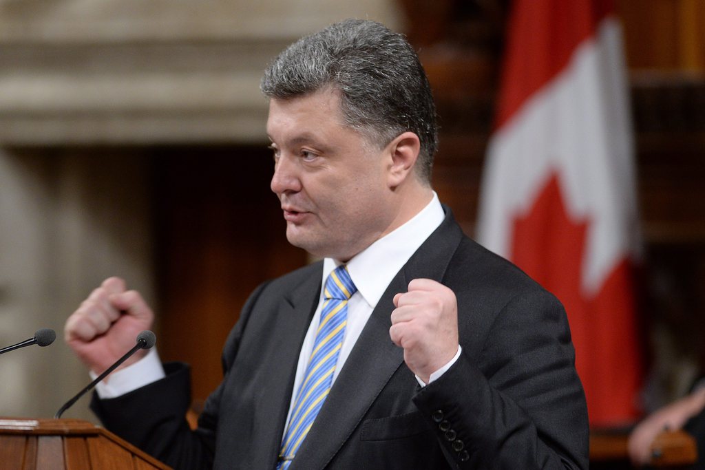 Le président ukrainien Petro Porochenko a demandé mercredi au Canada de l'aider à bâtir des liens solides avec l'Otan. 