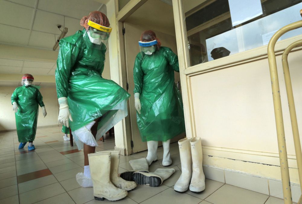 Sri Lankan health workers wear protective gear as they attend a preparedness program for Ebola at the Infectious Disease Hospital for fever in Colombo, Sri Lanka, Tuesday, Oct.28, 2014. Airports in Asia have stepped up their defenses: screening passengers who have travelled from affected countries, taking any with high temperature for observation and trying to keep contact them with for 21 days, the incubation period. According to the World Health Organization, more than 10,000 people have been infected with Ebola and nearly half of them have died. (AP Photo/Eranga Jayawardena)